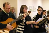 Staff members at the Hebrew Home singing at memorial service. From left, Larry Applewhite, Liisa Murray and Olivia Cohen.