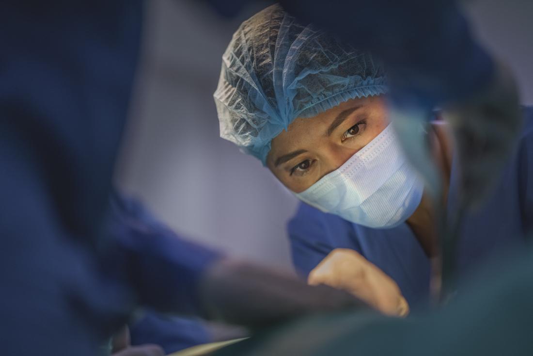 Surgeon working on appendectomy in operating theatre