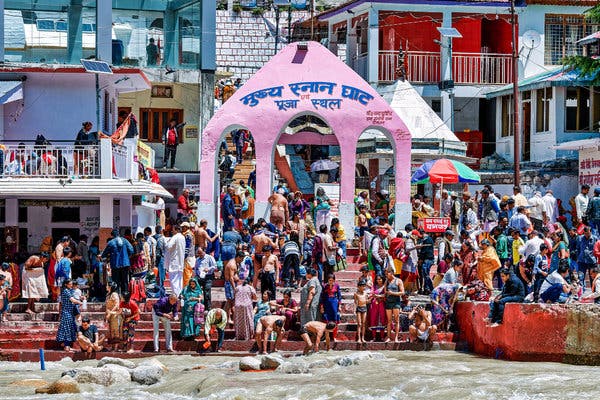 Pilgrims bathed in the Bhagirathi River, at the headwaters of the Ganges, in Gangotri, India. 